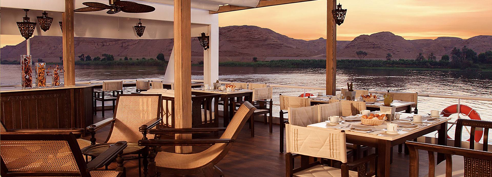 Gorgeous sunset views from the deck dining area on Sanctuary Sun Boat III