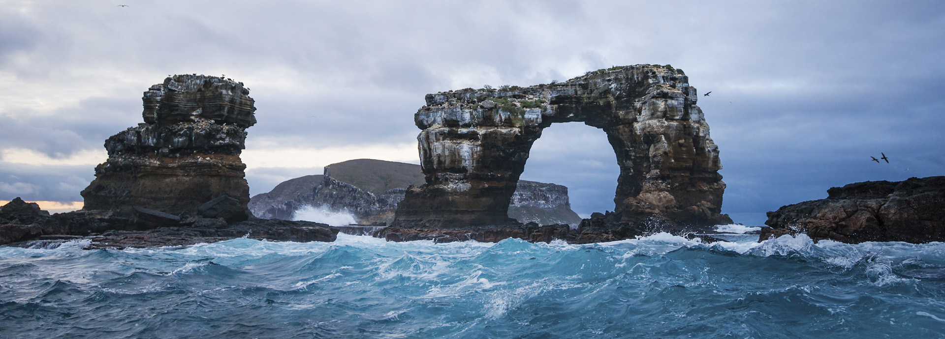 A dramatic ocean view of Darwin's Arch in the Galápagos Islands