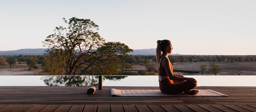 Guest meditating at Chichele Presidential luxury safari Lodge in South Luangwa National Park, Zambia