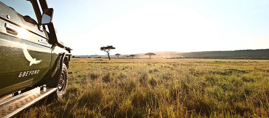 Luxury Safari Game Vehicle With The Plains Of Kenya In The Background