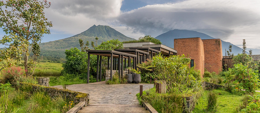 The contemporary Kataza House luxury lodge rests in the foothills of Volcanoes National Park Rwanda