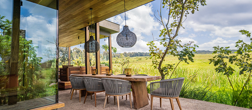 Kataza House dining area with views of Volanoes National Park, Rwanda