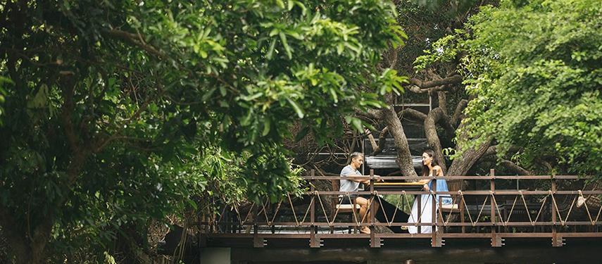 Couple enjoying drinks surrounded by forests at Uga Jungle Beach