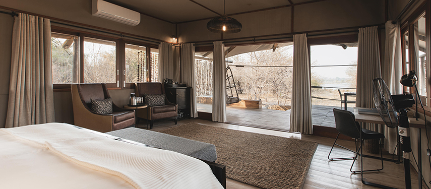 Open-plan luxury tent at Toka Leya with views onto a private deck