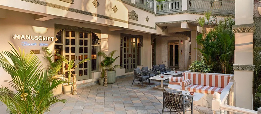 Outdoor courtyard seating near the main entrance of Manuscript – Jhilwara Haveli