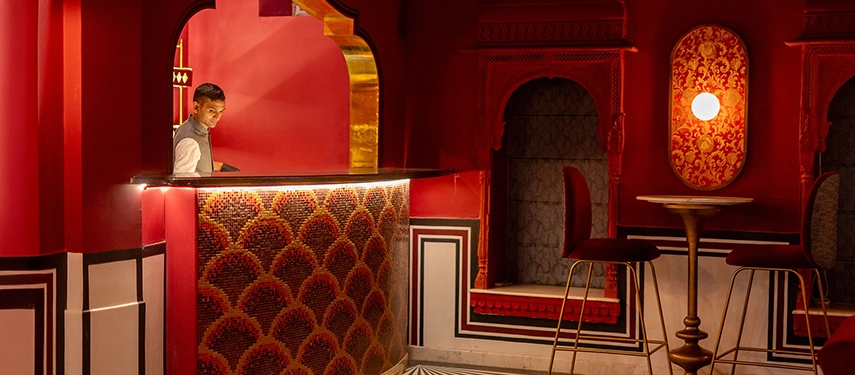 A stylish bar area at Padmaa Haveli showcasing mosaic textures, intimate lighting, and traditional architectural details.