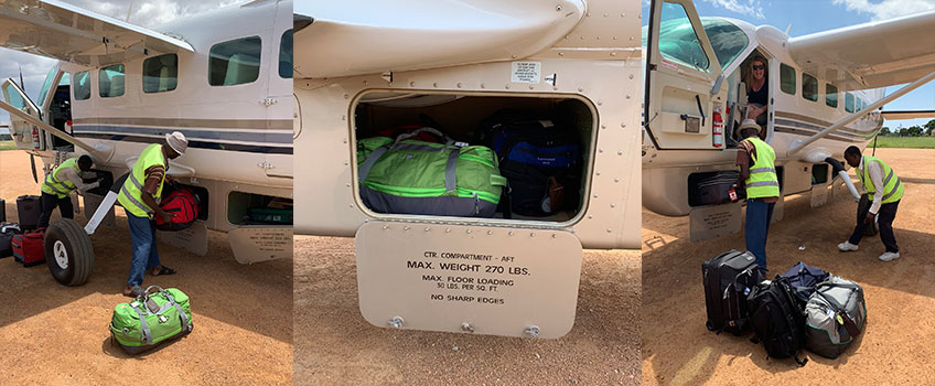 A soft-sided bag is essential when you pack for a safari. Staff packing luggage for an internal light-aircraft transfer