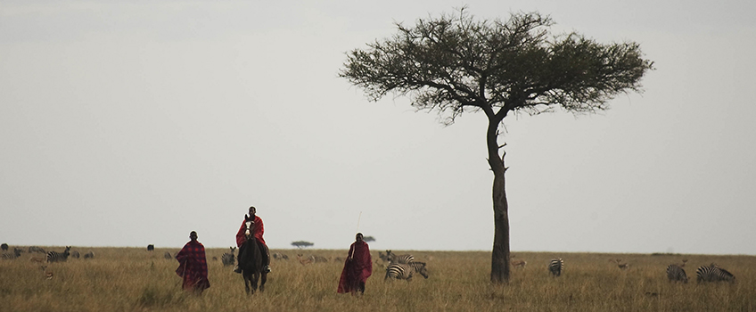 Maasai tribesmen on horseback in Kenya