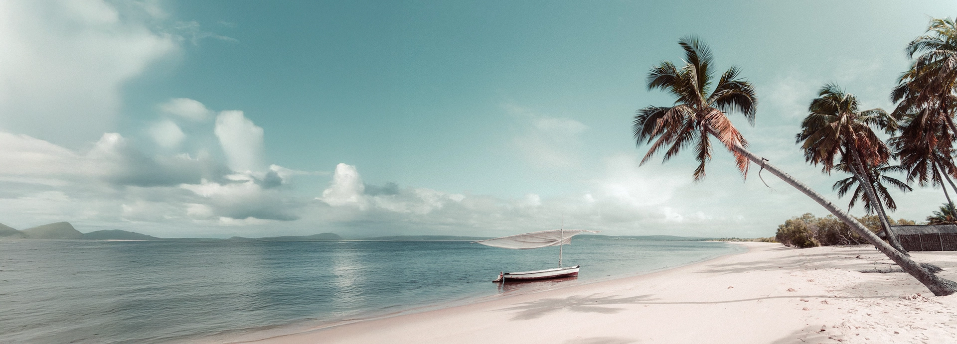 A traditional sailing boat lies on a deserted beach in the Bazaruto Archipelago in Mozambique.
